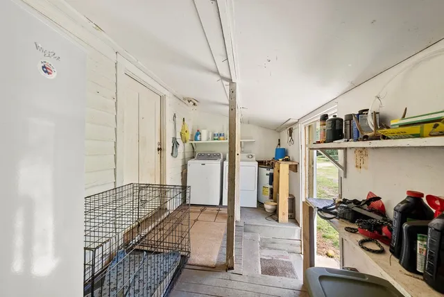 a living room with lots of furniture and a wooden floor