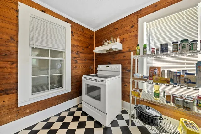 a kitchen with stainless steel appliances granite countertop a stove and a sink