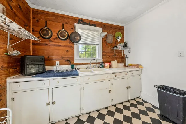 a room with cabinets and window