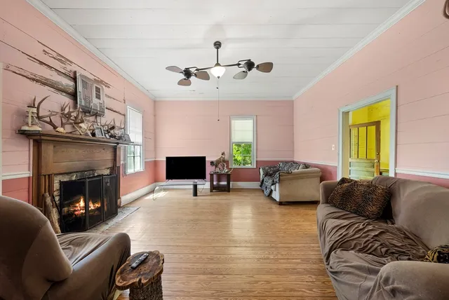 a living room with furniture and a fireplace