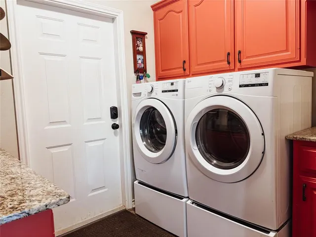 a utility room with dryer and washer