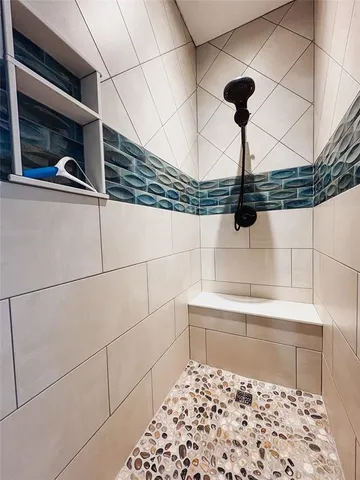 a close view of a shower and a sink