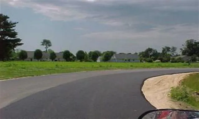 a view of a golf course with a park