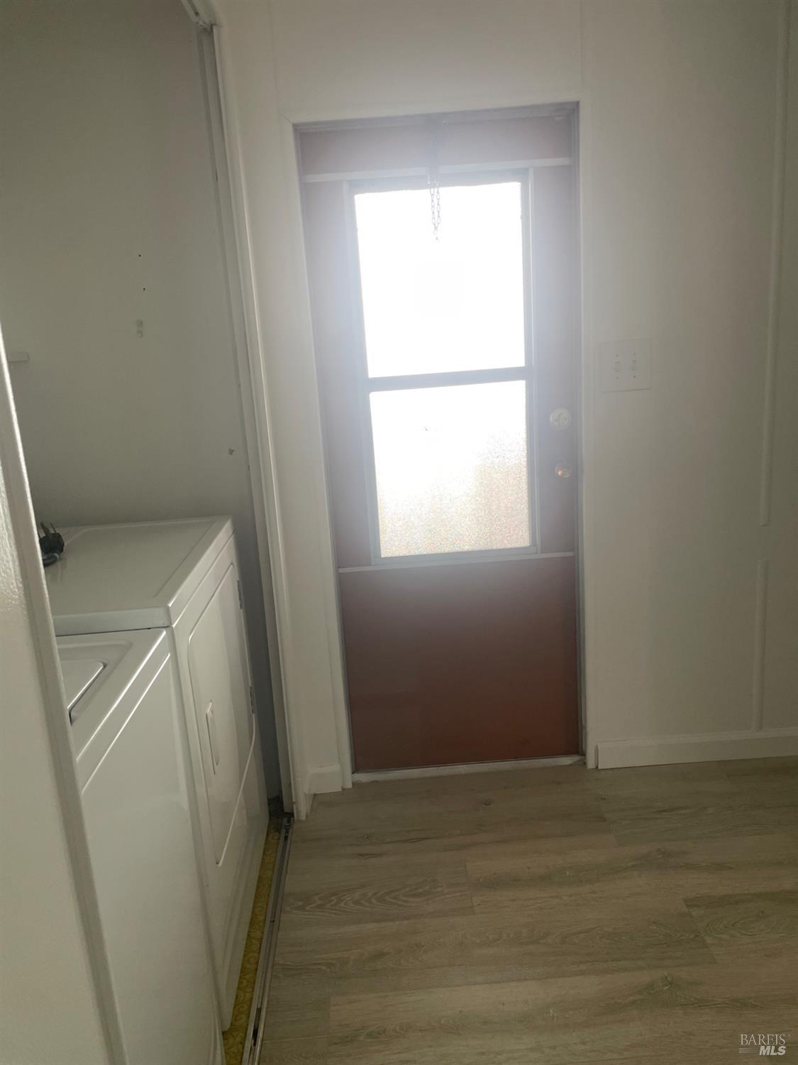 94 Buckwood Place Santa Rosa, CA 95409 - Photo 11 of 25 a view of a room with wooden floor and window