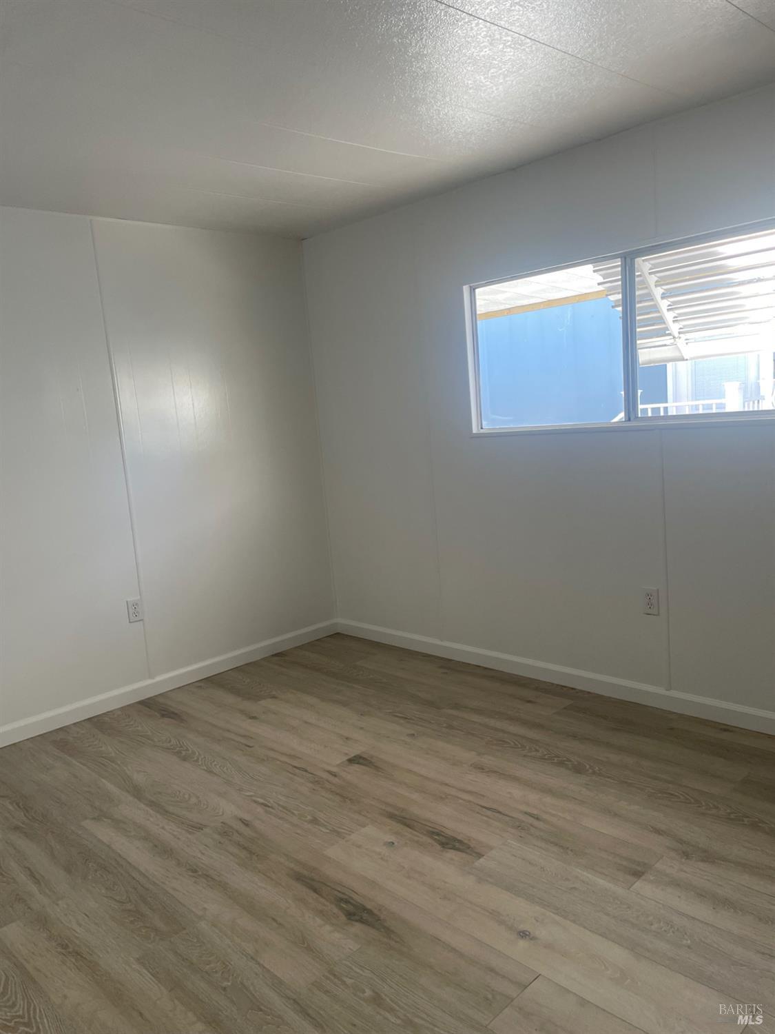 94 Buckwood Place Santa Rosa, CA 95409 - Photo 22 of 25 a view of an empty room and window