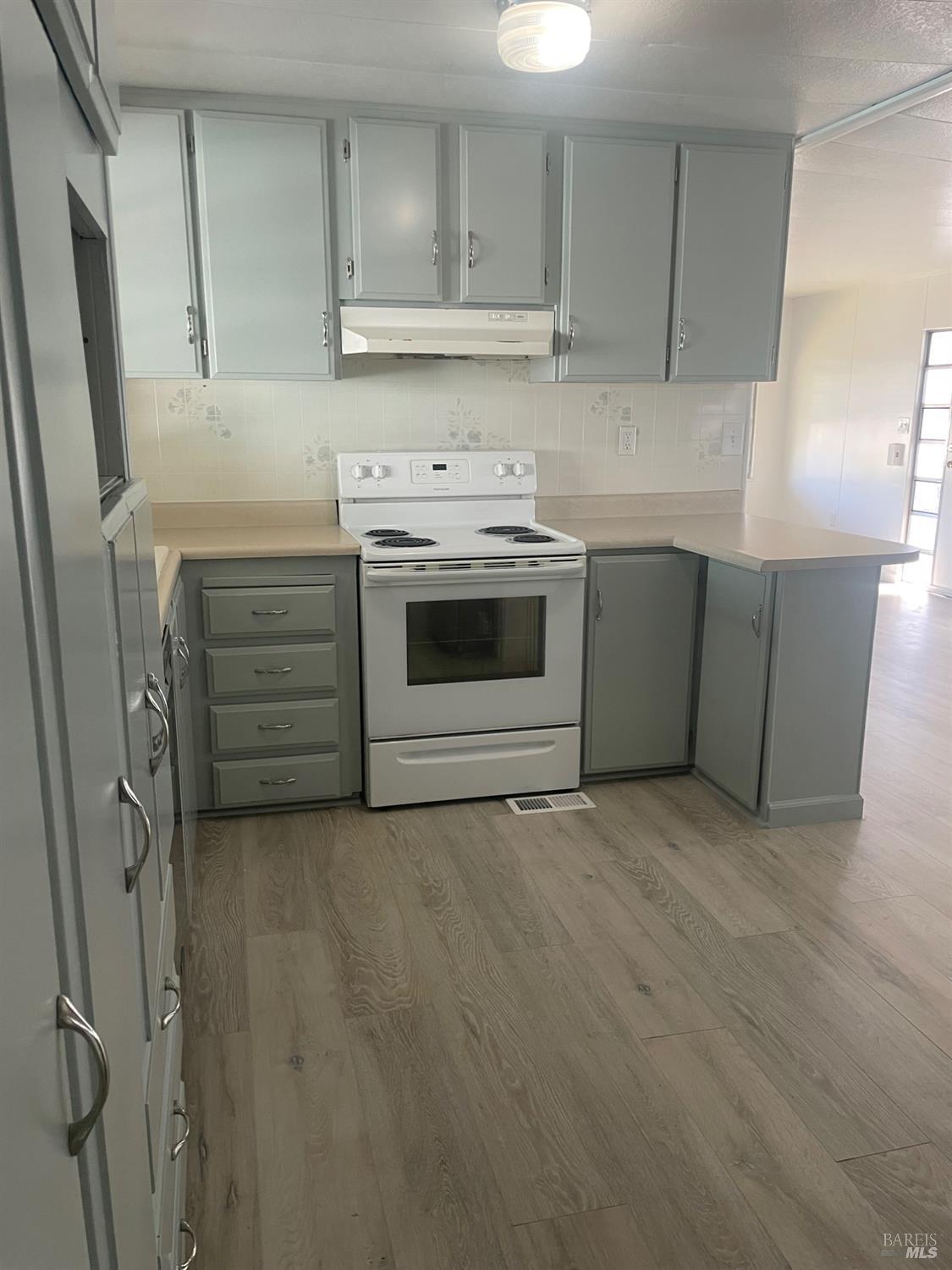 94 Buckwood Place Santa Rosa, CA 95409 - Photo 6 of 25 a kitchen with cabinets appliances and a counter top