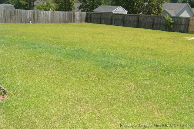 a swimming pool with wooden fence