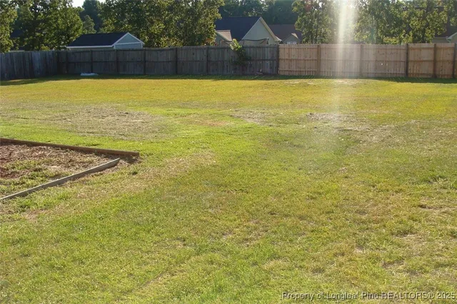 a view of a swimming pool with an outdoor space and seating area