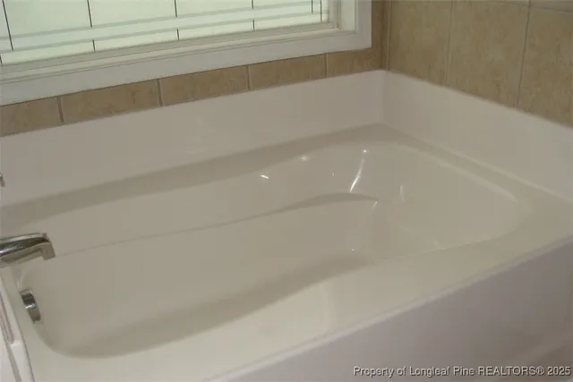 a bathroom with bathtub