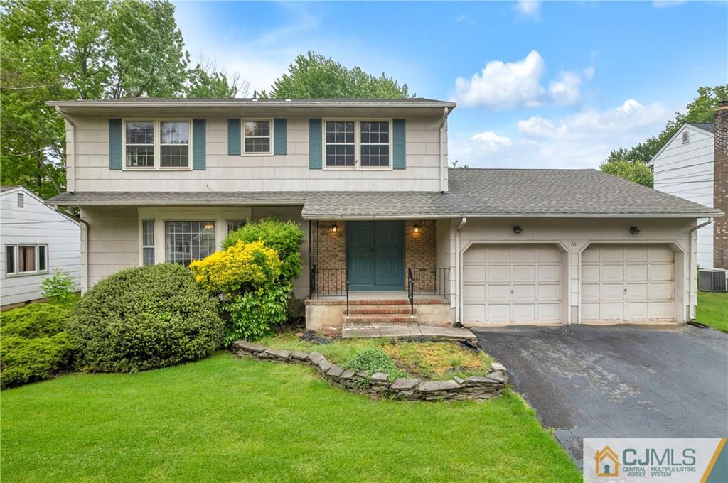 65 Dellwood Road Edison, NJ 08820 - Photo 1 of 24 a front view of a house with garden