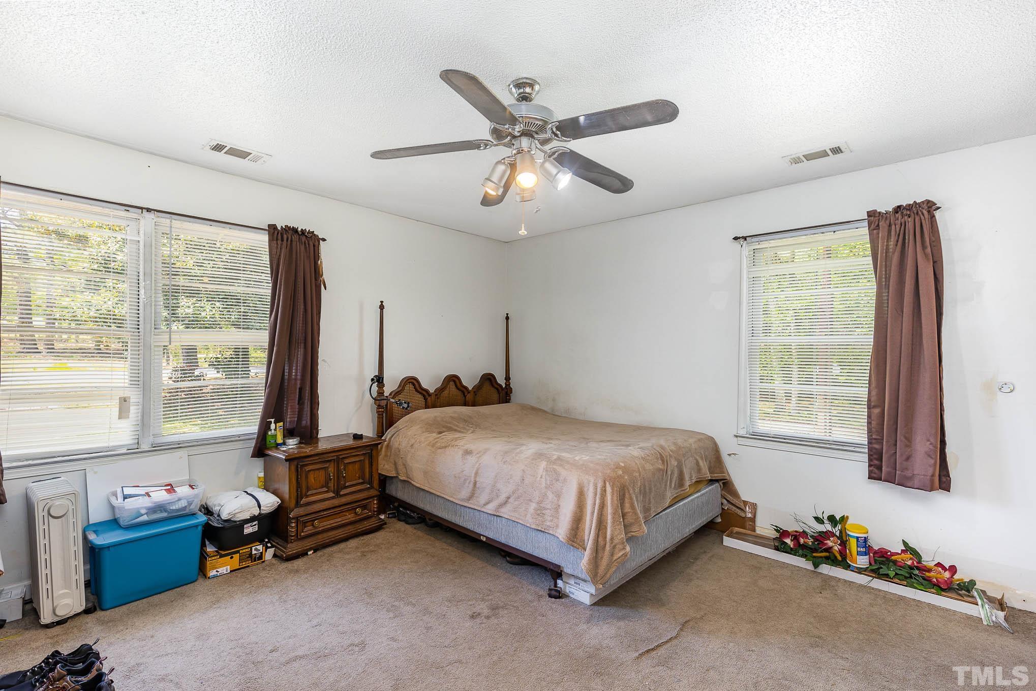 435 Temple Road Bunnlevel, NC 28323 - Photo 14 of 32 a bedroom with a bed and a large window