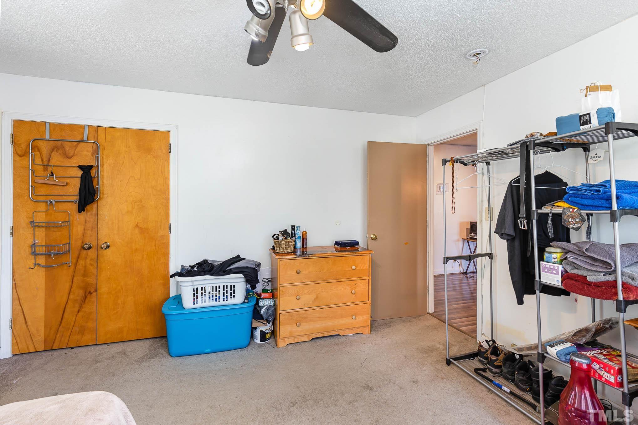 435 Temple Road Bunnlevel, NC 28323 - Photo 15 of 32 a view of walk in closet with clothes and shoes