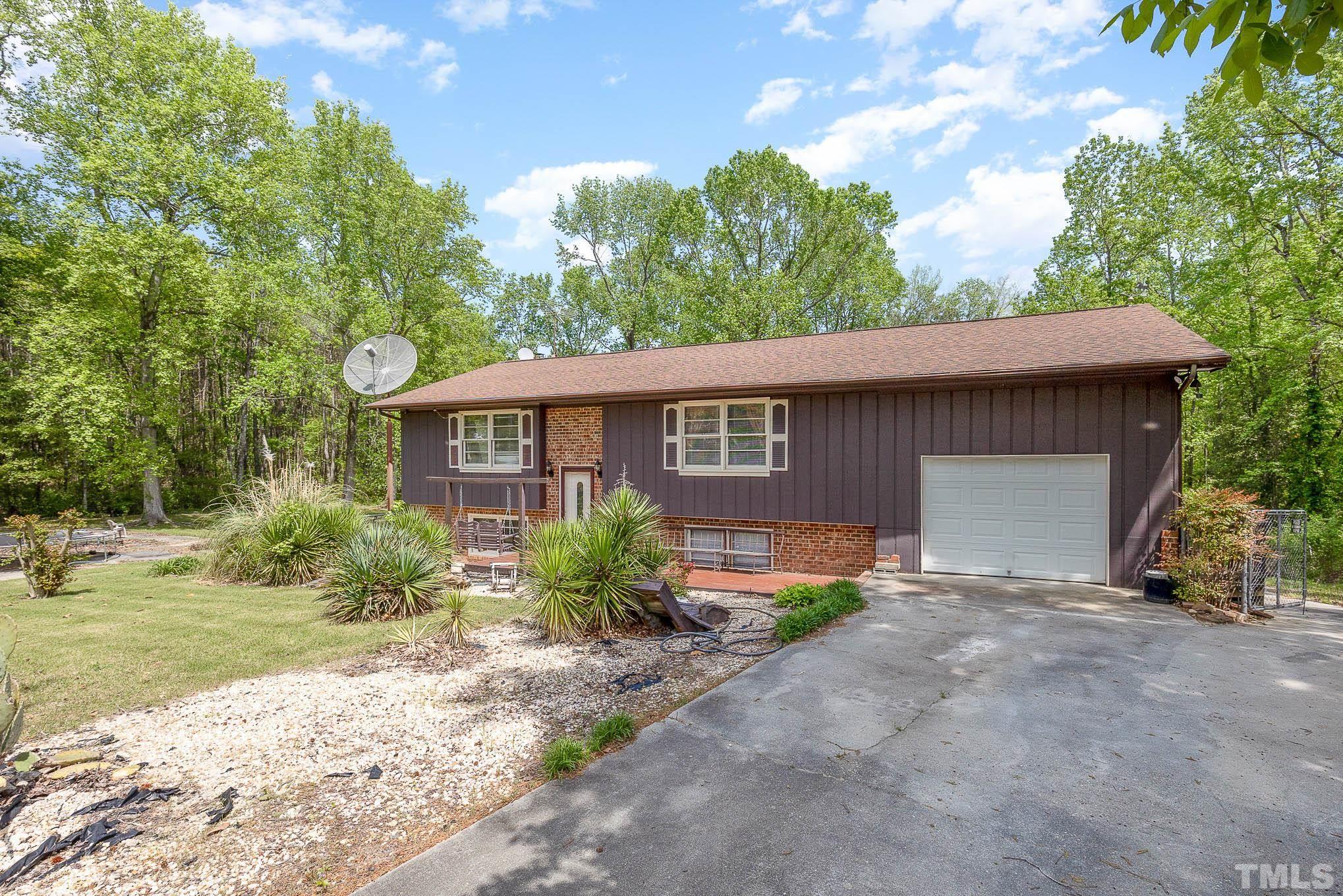 435 Temple Road Bunnlevel, NC 28323 - Photo 2 of 32 a view of a house with backyard and garden
