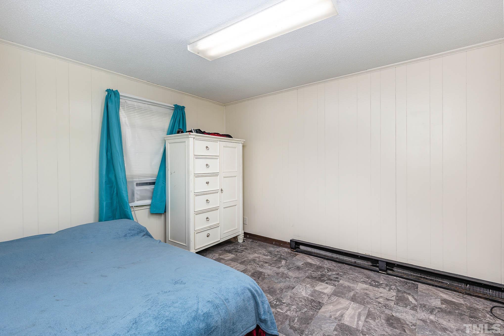 435 Temple Road Bunnlevel, NC 28323 - Photo 21 of 32 a view of a bedroom with cabinet