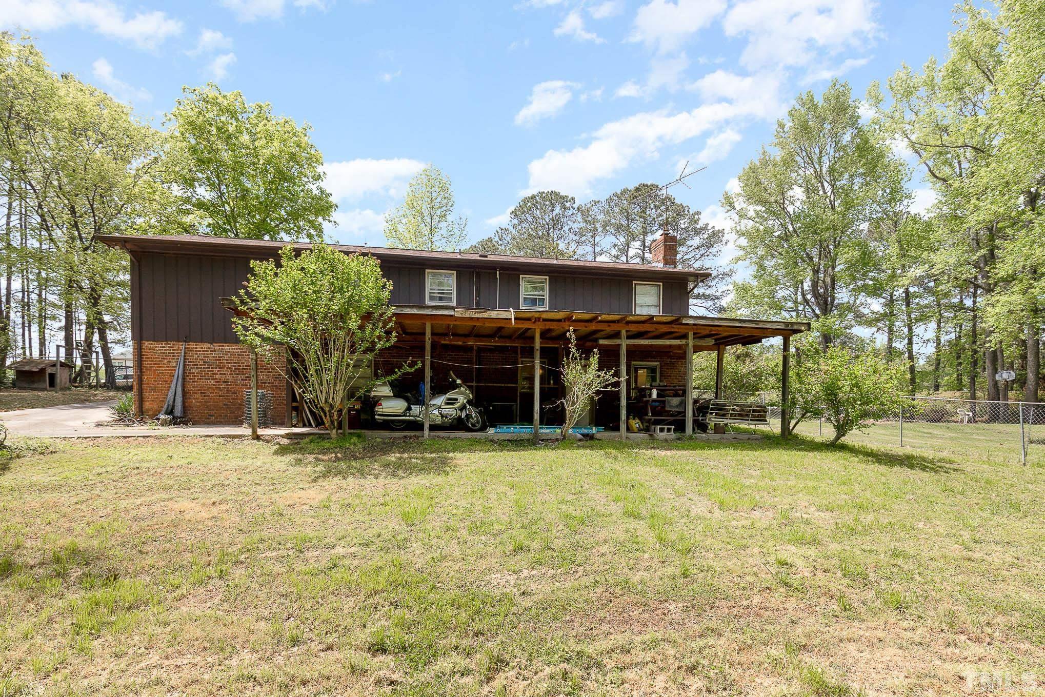 435 Temple Road Bunnlevel, NC 28323 - Photo 29 of 32 a view of a house with backyard porch and sitting area