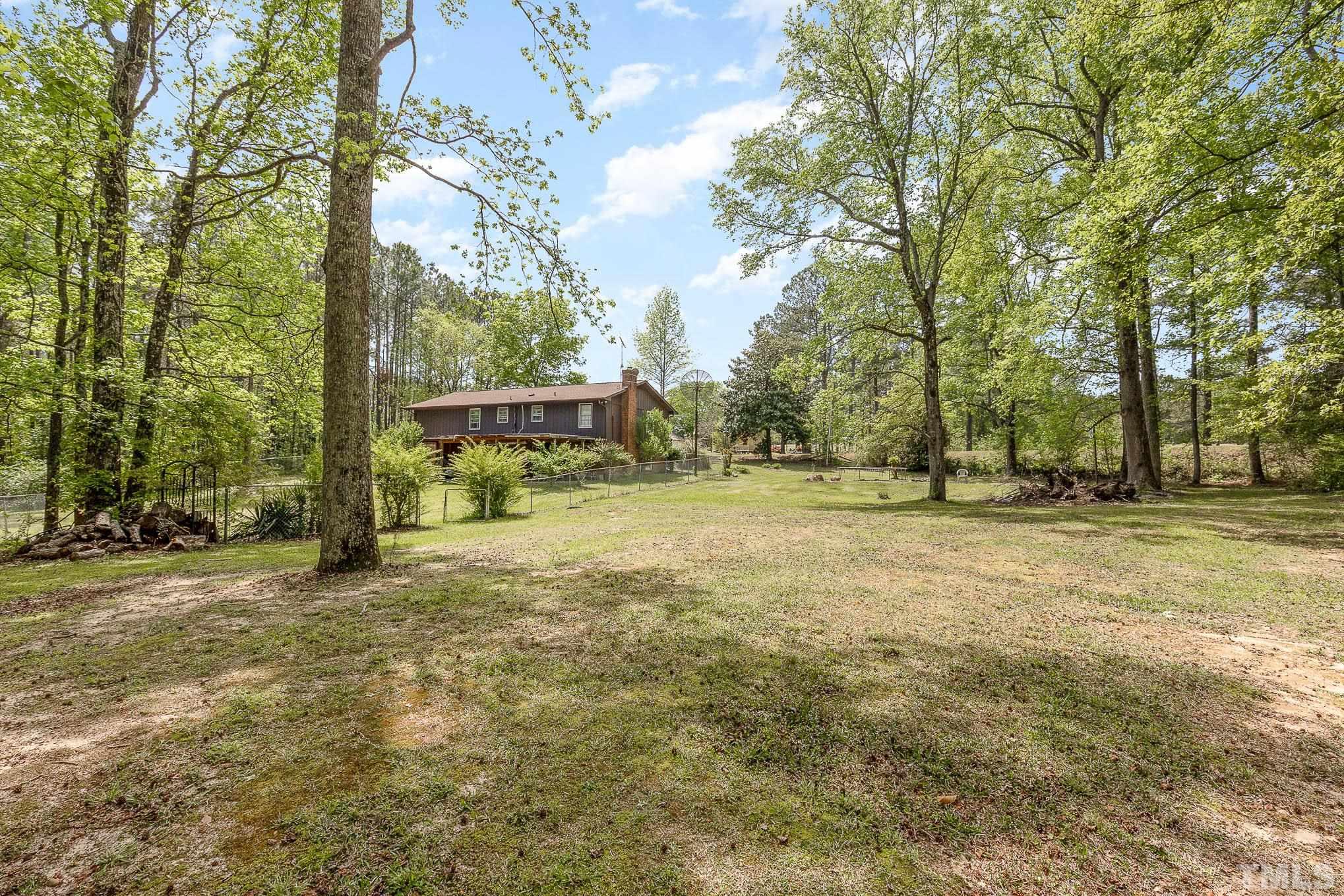 435 Temple Road Bunnlevel, NC 28323 - Photo 31 of 32 a view of a field with trees