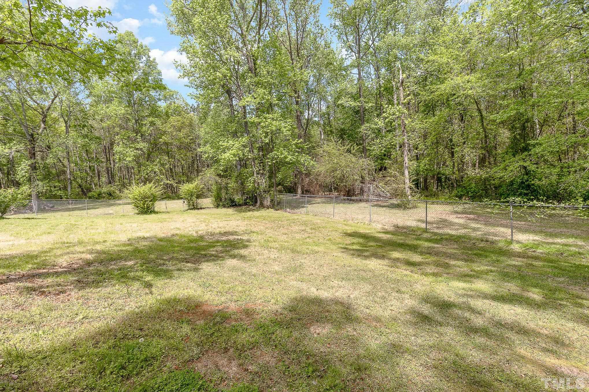 435 Temple Road Bunnlevel, NC 28323 - Photo 32 of 32 a view of a yard with a tree