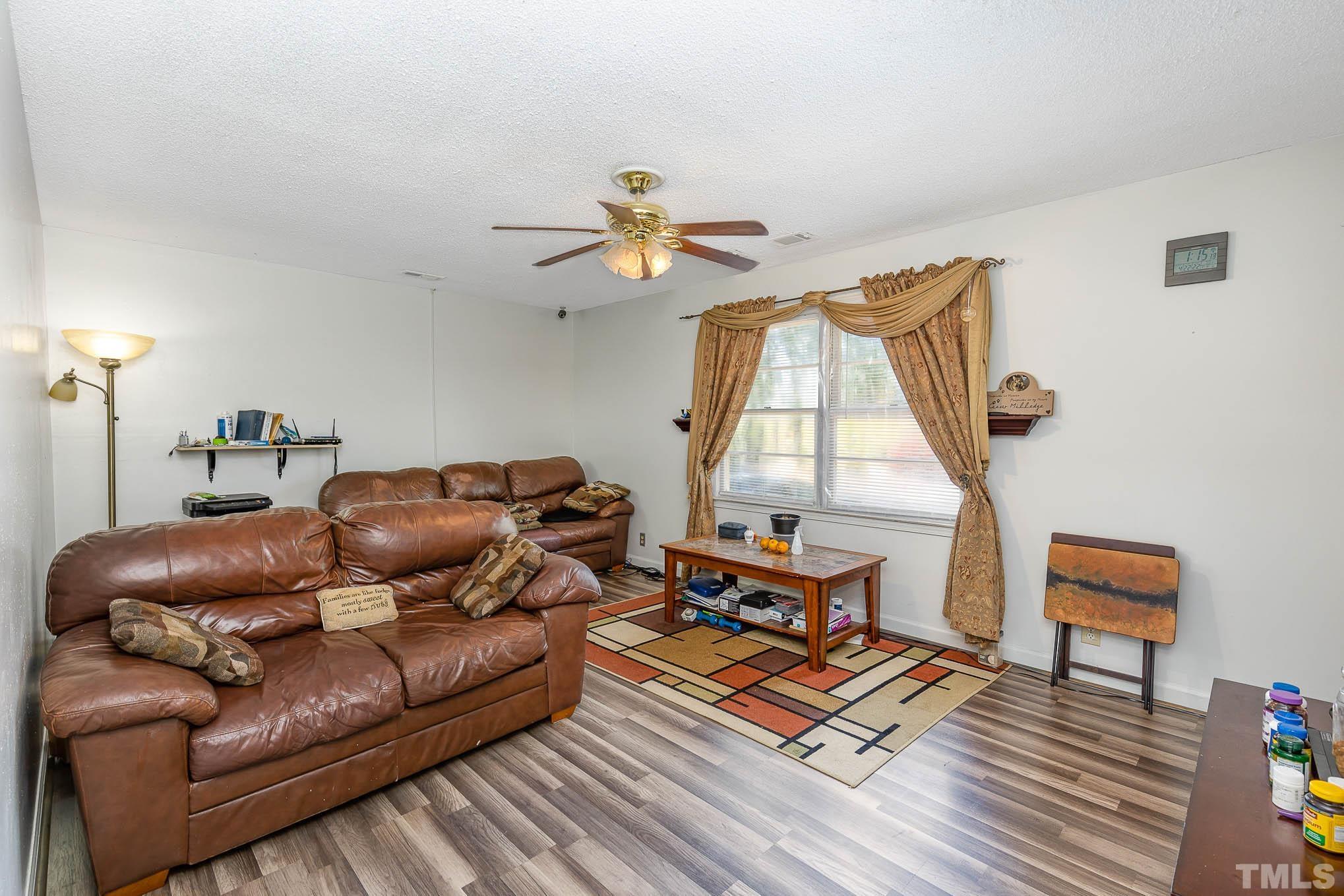 435 Temple Road Bunnlevel, NC 28323 - Photo 5 of 32 a living room with furniture and a window