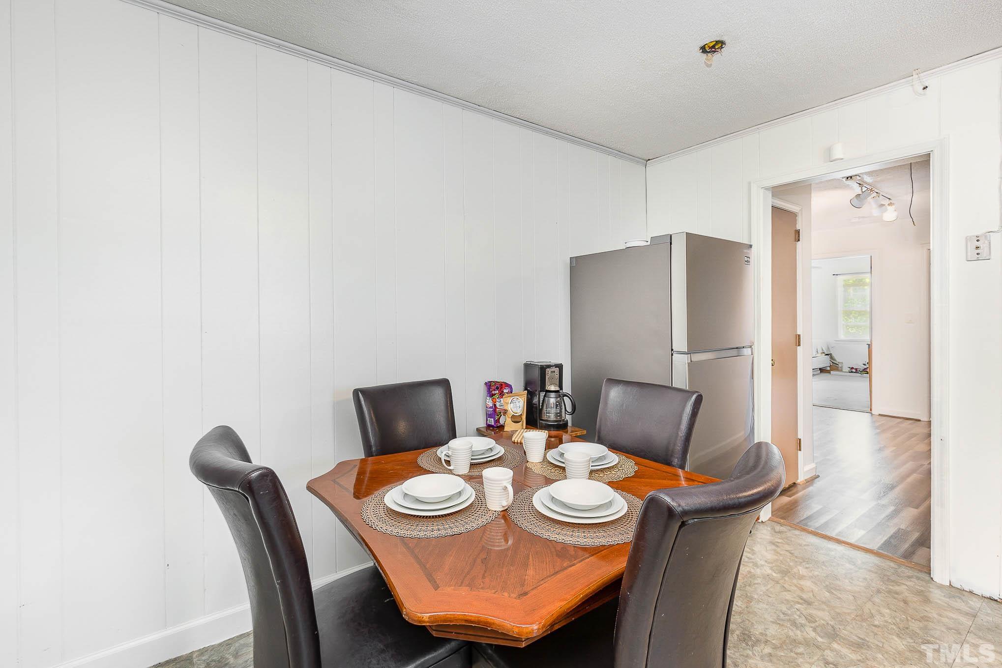 435 Temple Road Bunnlevel, NC 28323 - Photo 8 of 32 a view of a dining room with furniture and wooden floor