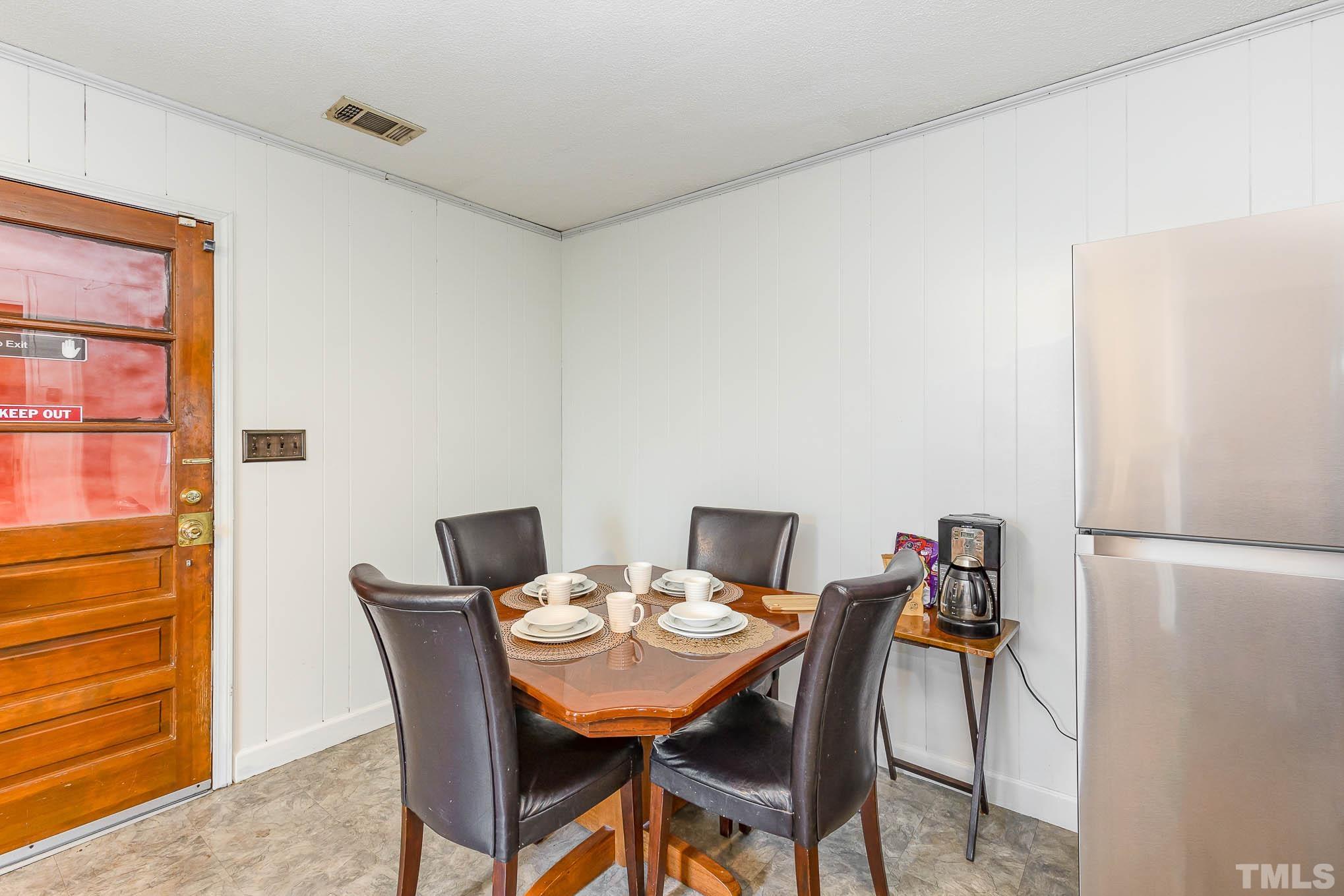 435 Temple Road Bunnlevel, NC 28323 - Photo 9 of 32 a view of a dining room with furniture and a window