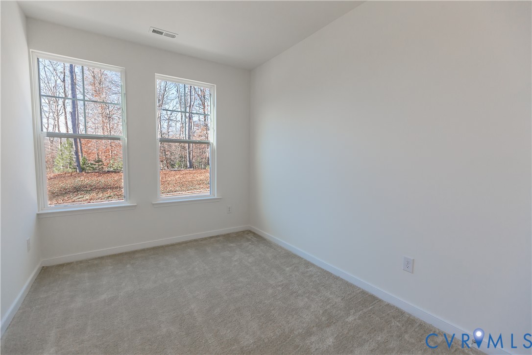4116 Ebbies Crossing Midlothian, VA 23112 - Photo 17 of 42 an empty room with windows