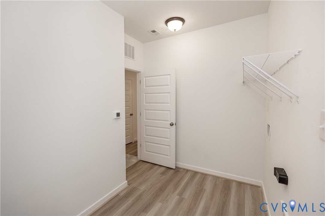 4116 Ebbies Crossing Midlothian, VA 23112 - Photo 21 of 42 a view of walk in closet with empty racks