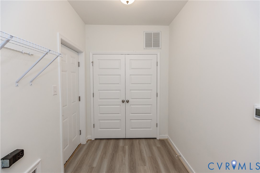 4116 Ebbies Crossing Midlothian, VA 23112 - Photo 22 of 42 a view of walk in closet with empty racks
