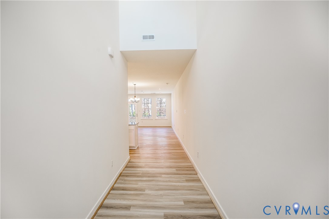 4116 Ebbies Crossing Midlothian, VA 23112 - Photo 3 of 42 a view of a hallway with wooden floor