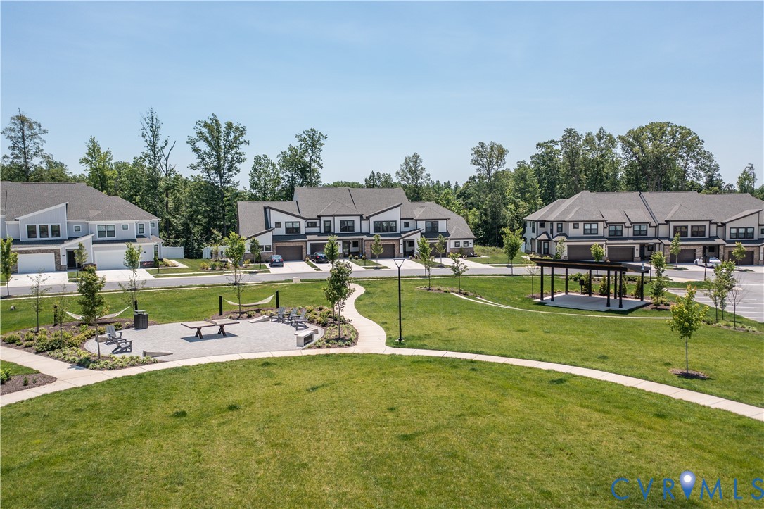 4116 Ebbies Crossing Midlothian, VA 23112 - Photo 41 of 42 an aerial view of a swimming pool with lawn chairs under an umbrella
