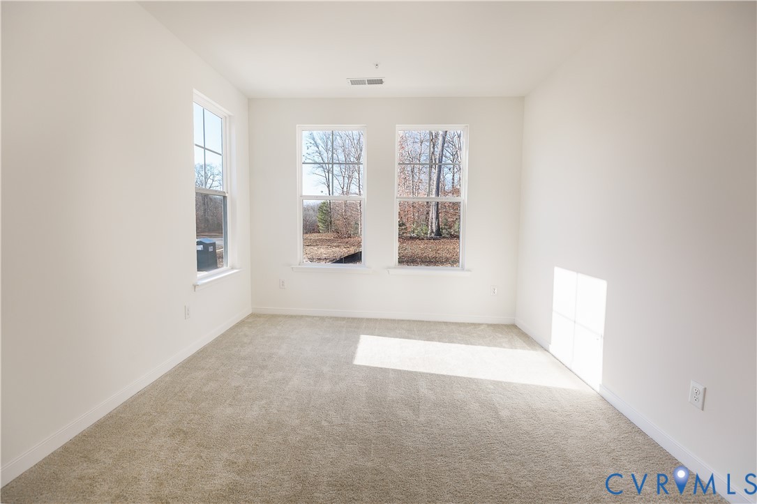 4116 Ebbies Crossing Midlothian, VA 23112 - Photo 9 of 42 a view of an empty room with a window