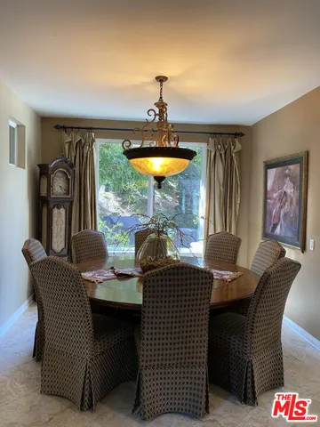 a kitchen with a stove and cabinets