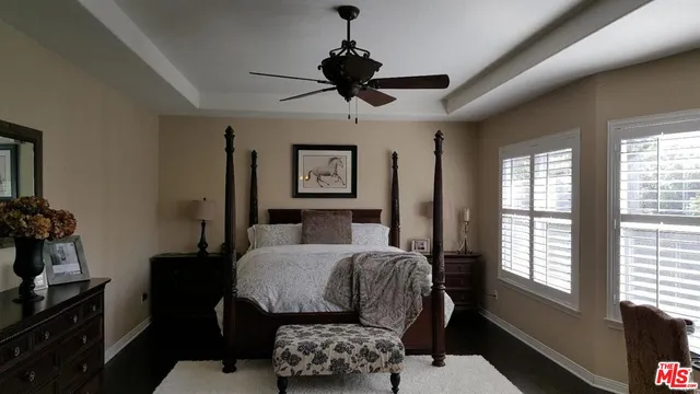 a large bathroom with a large tub and sink