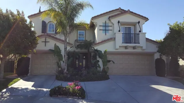 a front view of a house with yard