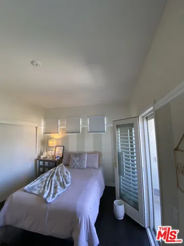 a backyard of a house with yard table and chairs