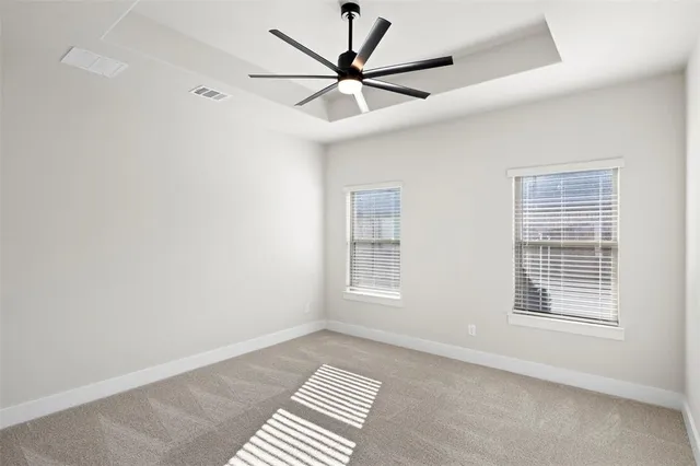 a view of room with stairs and a ceiling fan
