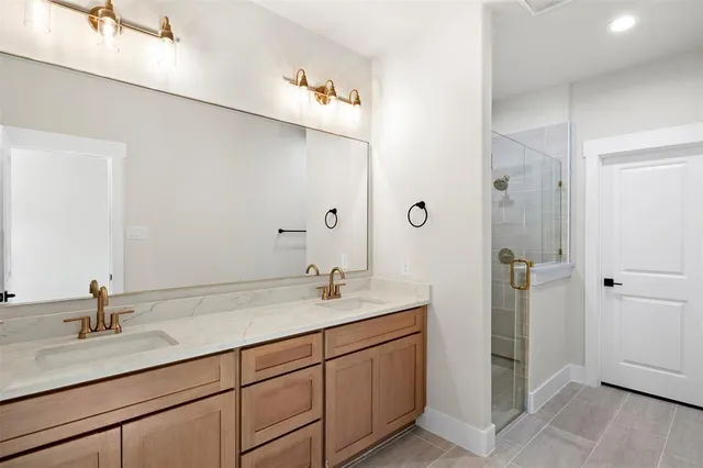 a bathroom with a shower and a sink