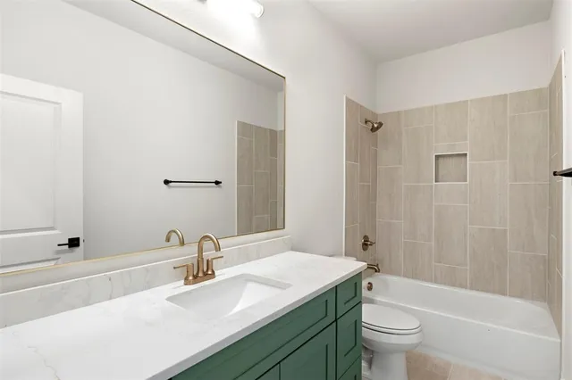 an empty room with a window and a ceiling fan