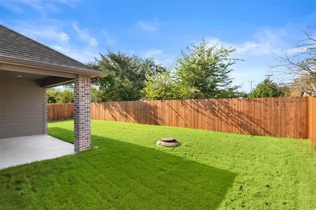 a view of a backyard with a garden
