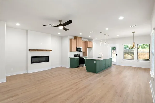 a view of an empty room with windows