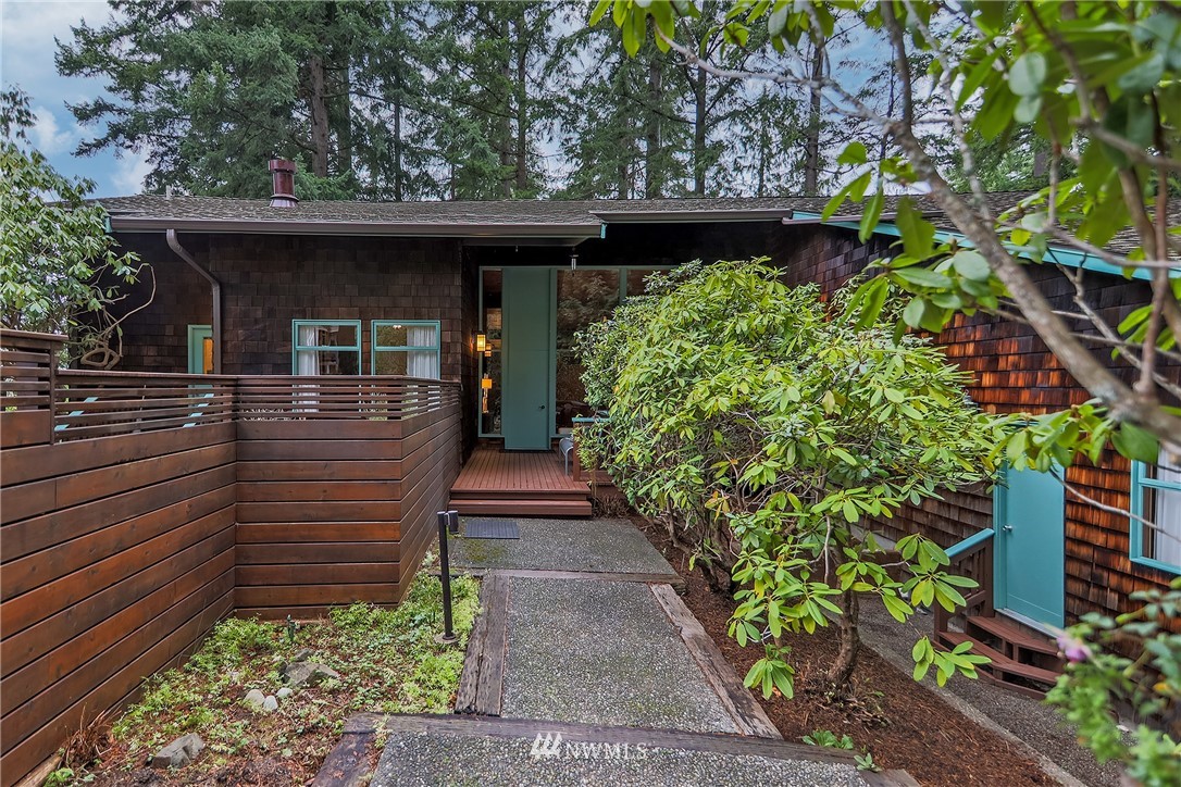 8316 Olympic View Drive Edmonds, WA 98026 - Photo 2 of 38 a view of a pathway of a house with potted plants