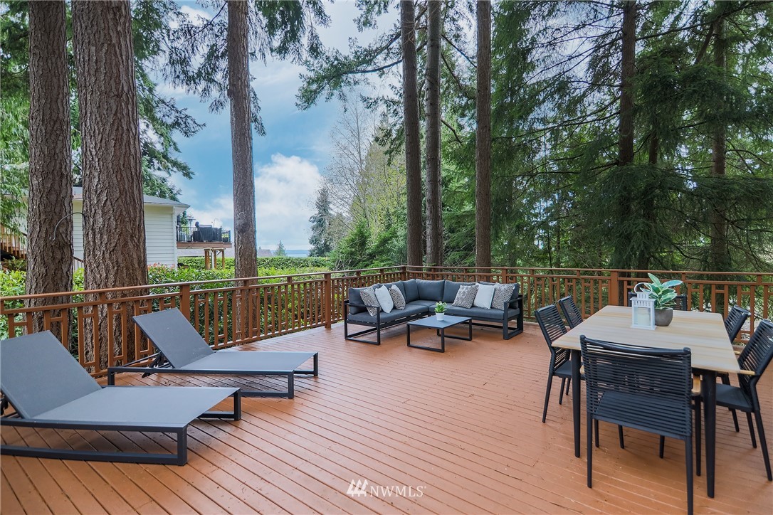 8316 Olympic View Drive Edmonds, WA 98026 - Photo 3 of 38 a view of a patio with wooden floor and a couches