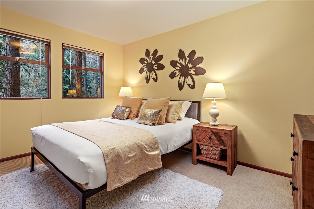 8316 Olympic View Drive Edmonds, WA 98026 - Photo 21 of 38 a bedroom with a bed and a painting on the wall