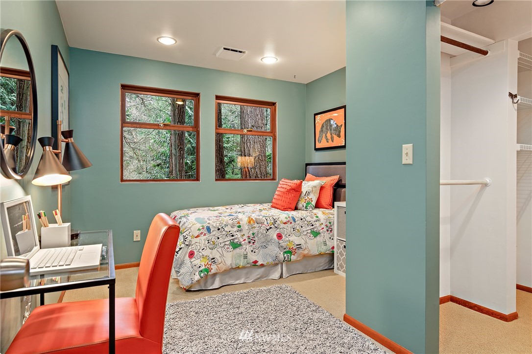 8316 Olympic View Drive Edmonds, WA 98026 - Photo 22 of 38 a bedroom with a bed and wooden floor