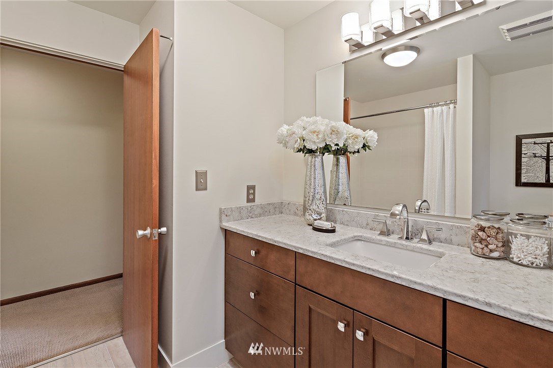 8316 Olympic View Drive Edmonds, WA 98026 - Photo 23 of 38 a bathroom with a double vanity sink and a mirror