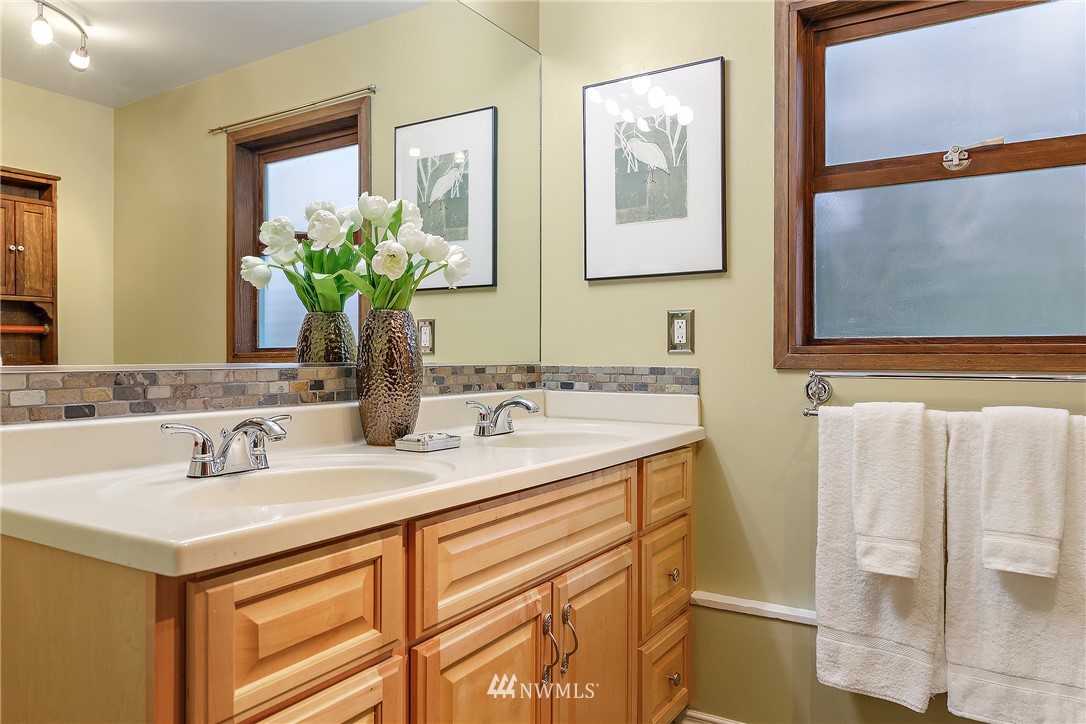 8316 Olympic View Drive Edmonds, WA 98026 - Photo 30 of 38 a bathroom with a sink and a mirror