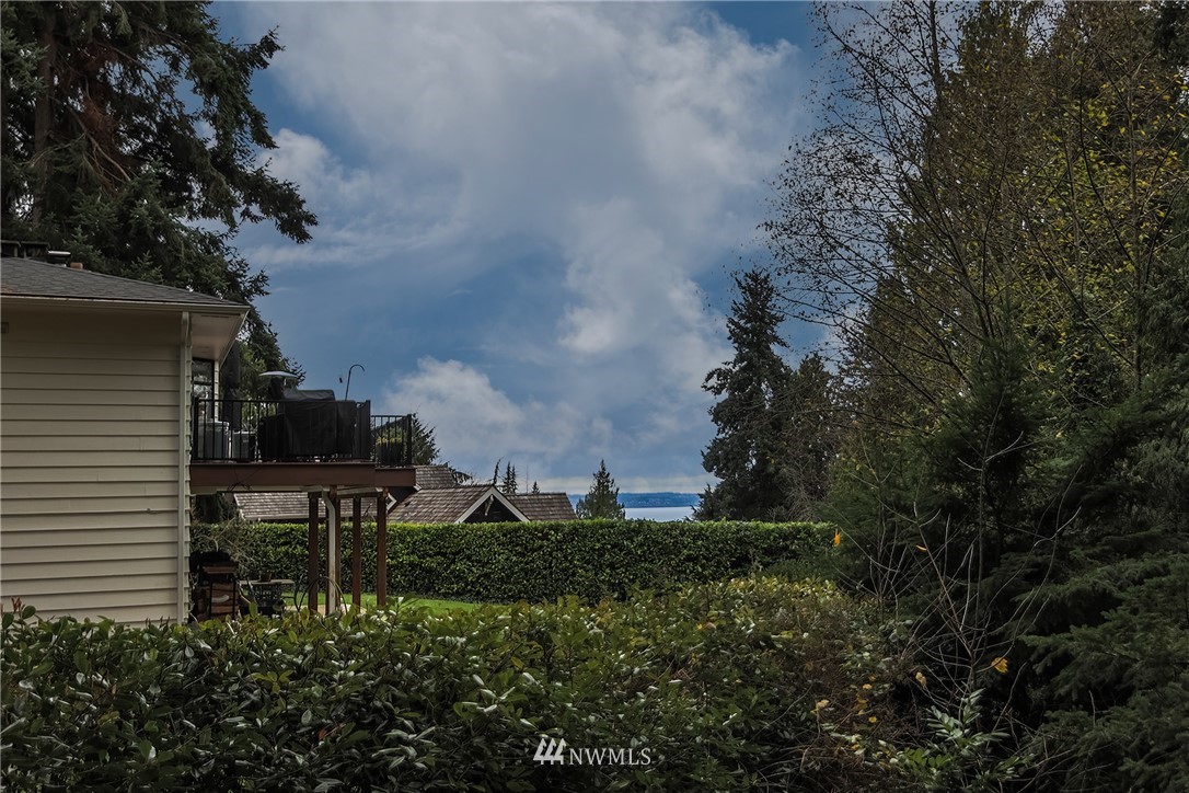 8316 Olympic View Drive Edmonds, WA 98026 - Photo 32 of 38 a view of a garden from a bench