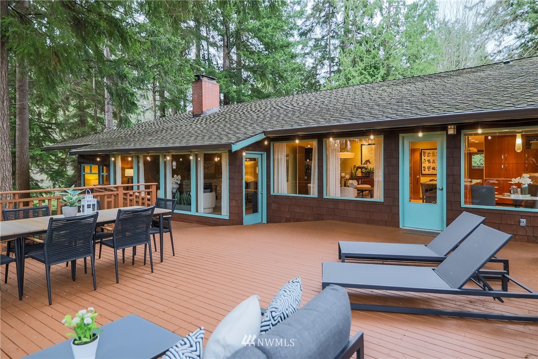 8316 Olympic View Drive Edmonds, WA 98026 - Photo 5 of 38 a view of a house with a patio and a garden