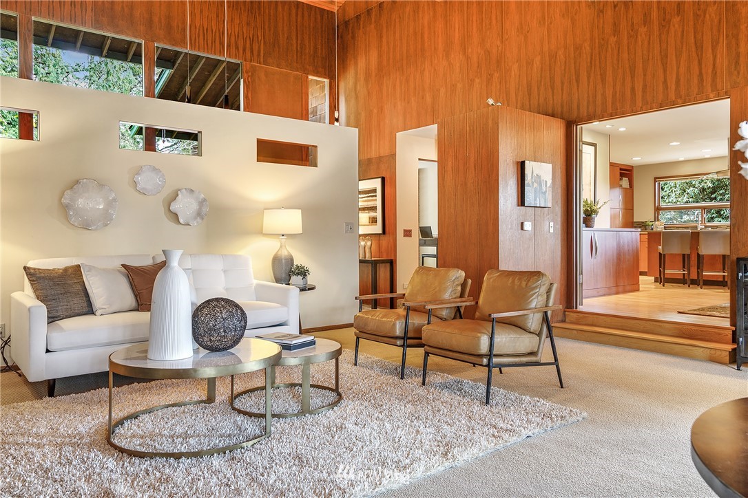8316 Olympic View Drive Edmonds, WA 98026 - Photo 7 of 38 a living room with furniture a clock and a table