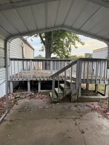 a view of a house with porch and wooden floor