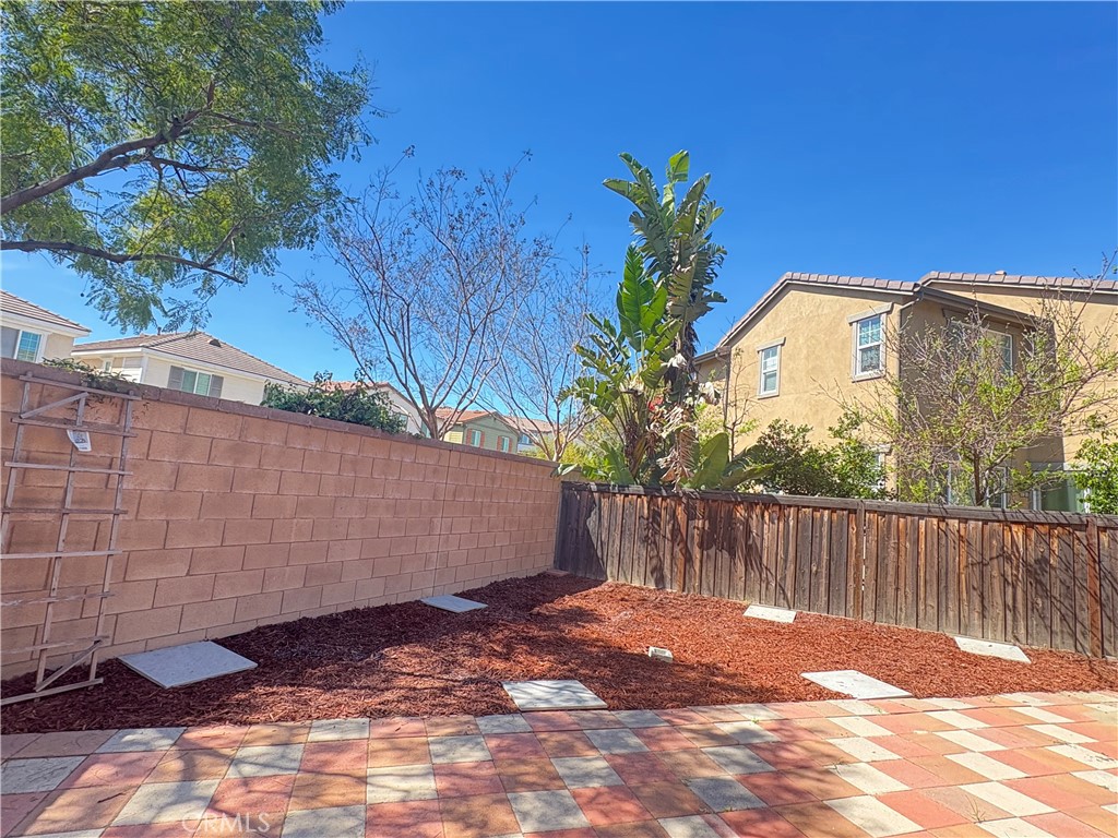 645 Liberation Way Fullerton, CA 92832 - Photo 3 of 20 a view of a wooden door and a yard